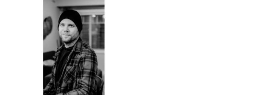 Benedict Beaumont in a check shirt, photographed in black and white