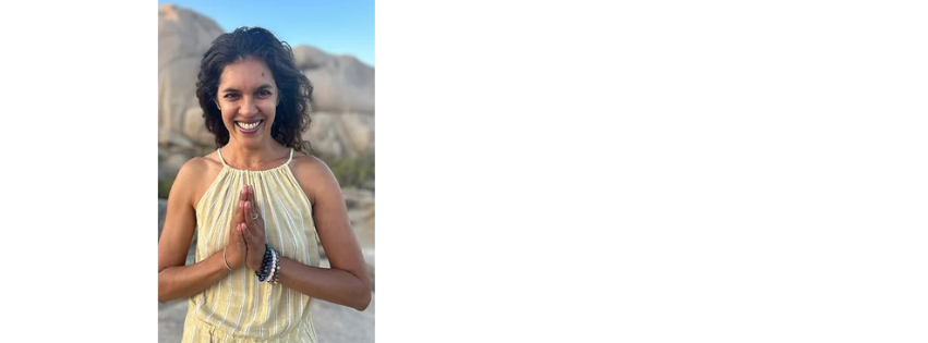 Zila Moosa in a yellow dress, hands at her heart, on a hillside
