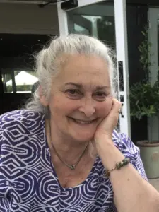 Ruth Buckingham resting her chin on her hand, smiling