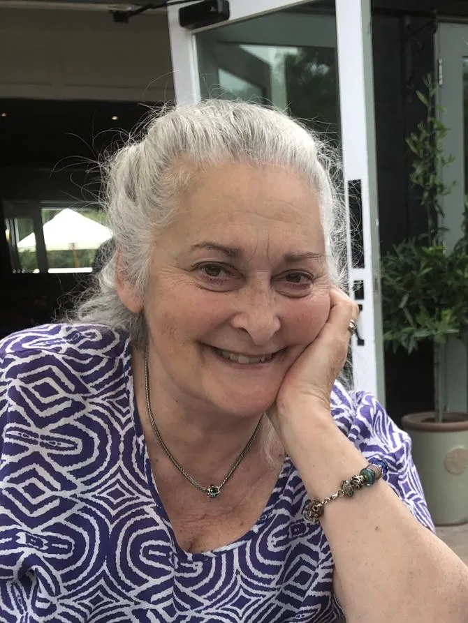 Ruth Buckingham resting her chin on her hand, smiling